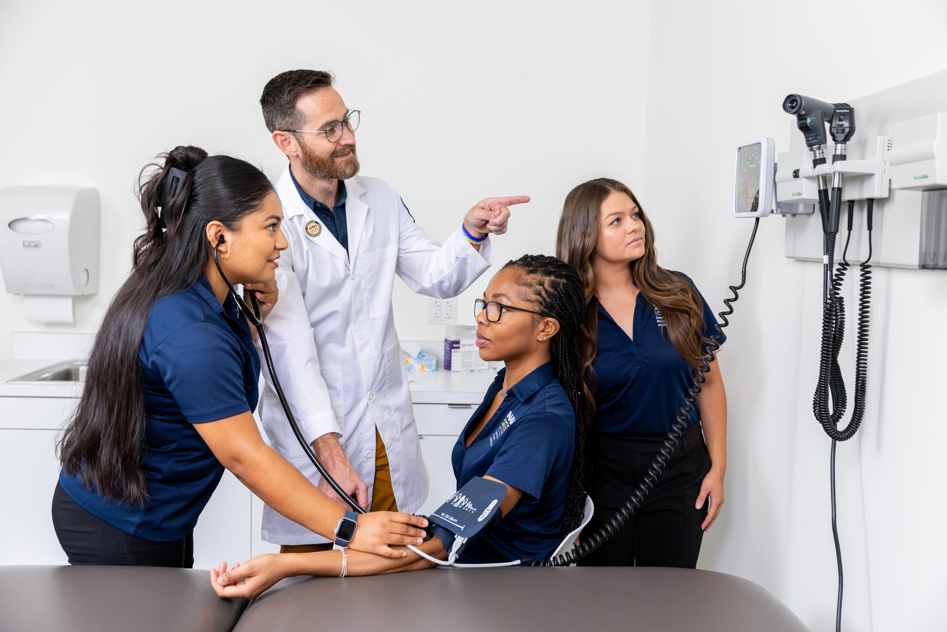 People in medical uniforms, doctor, and patients in a medical setting with medical equipment.